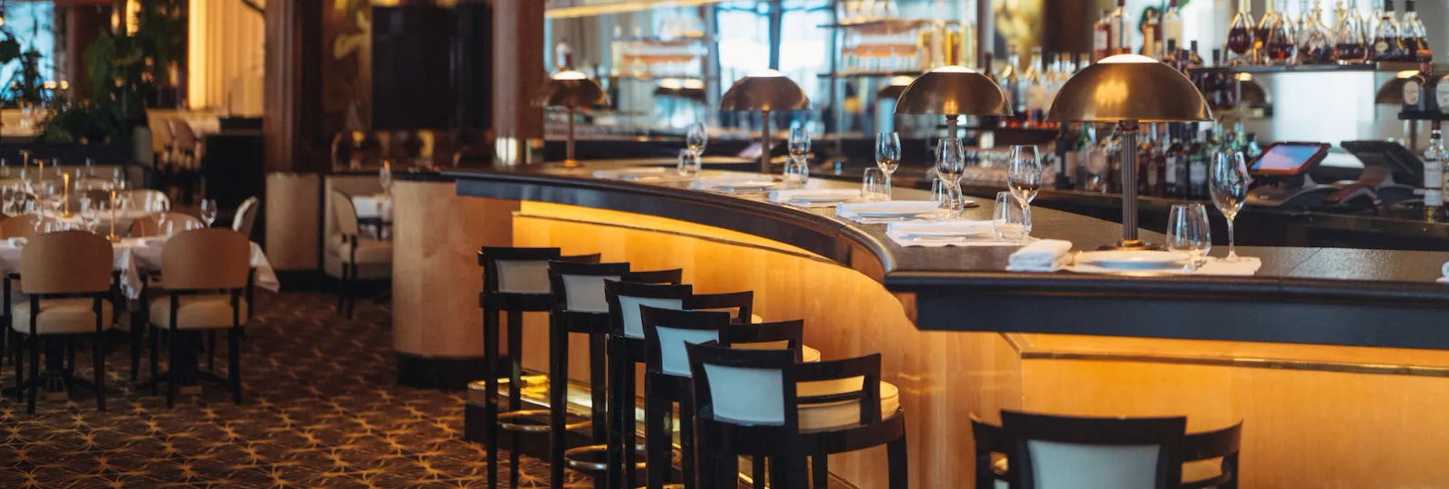 Overview of the Bar at Le Relais Plaza, and its mural representing Diane Chasseresse, with the dining room in the background, at Hotel Plaza Athénée, Paris