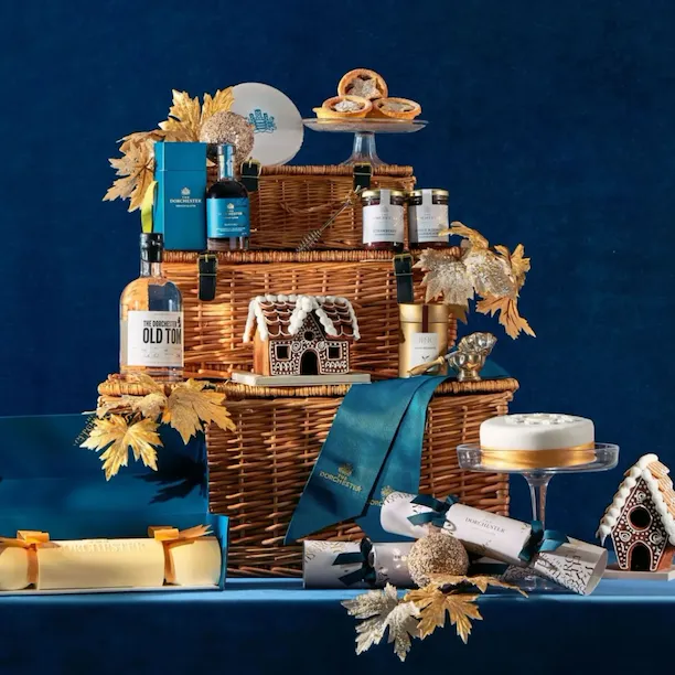 The Dorchester Retail items on blue velvet backdrop with soft dappled lighting