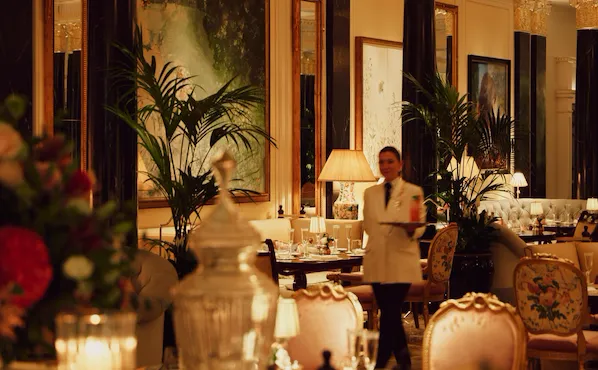 The Promenade after dark. Waitress in motion with drink on tray