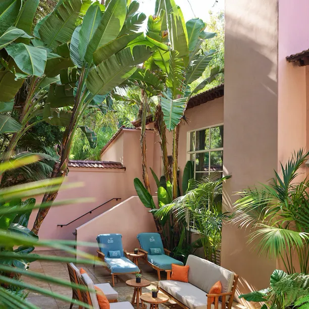Back patio of presidential suite with lounge chairs