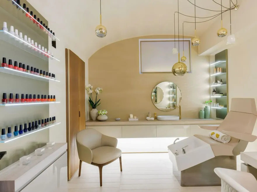Nails suite at The Eden Spa, with a wall of colourful nailpolish and a confortable chair when you can get you manicure and pedicure done.