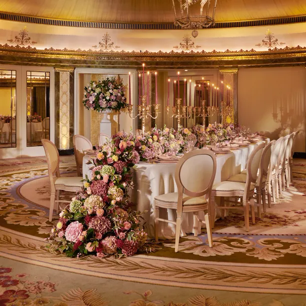 The Dorchester Gold and Silver event space set of fabulous evening event with a stunning floral centre perice