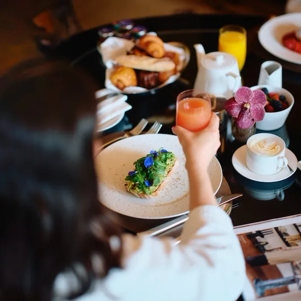 Woman looking out window of Park Lane Studio