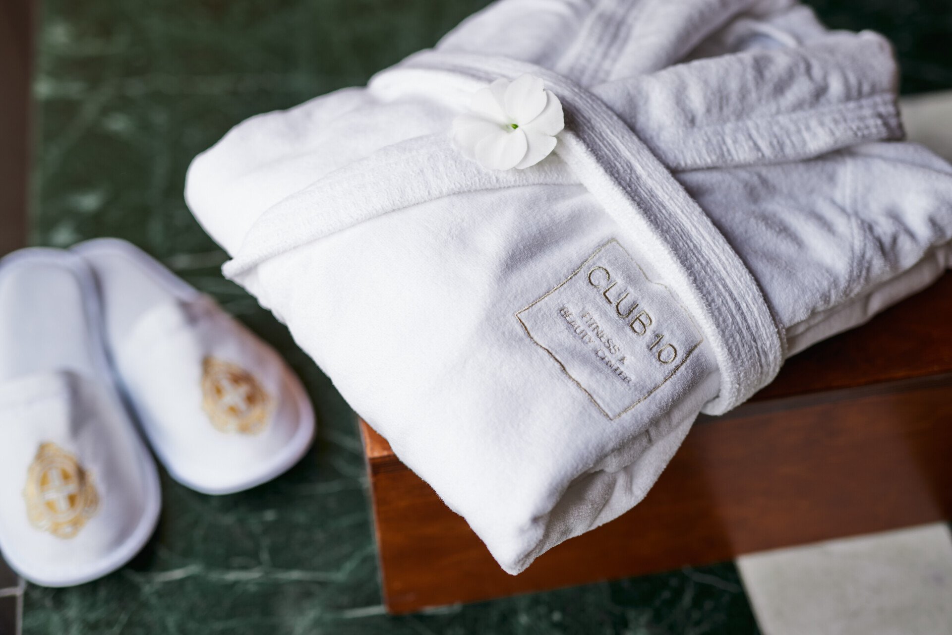 Customized towel and slipper at Club 10