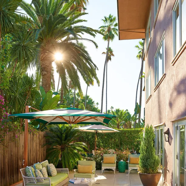Paul Williams suite sunny patio with garden furniture at The Beverly Hills Hotel, Los Angeles
