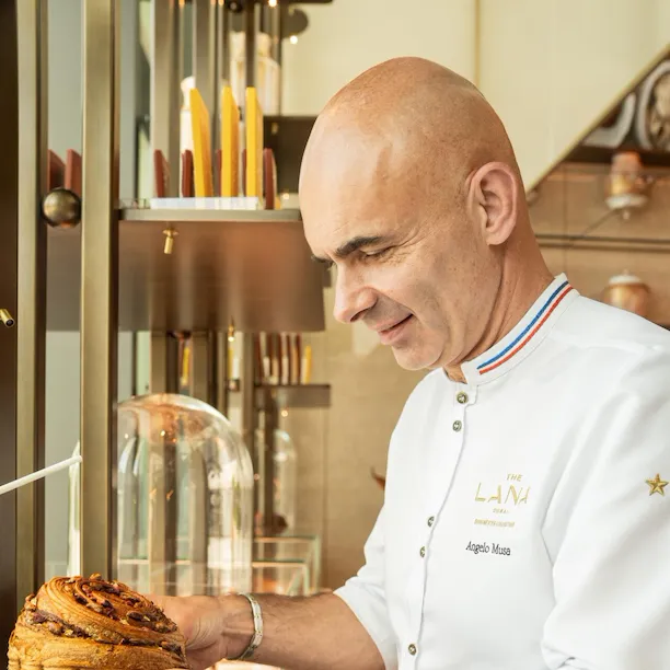 Images depicting pastries, team and interior details at Bonbon Café Angelo Musa located at The Lana, Dorchester Collection, Dubai.