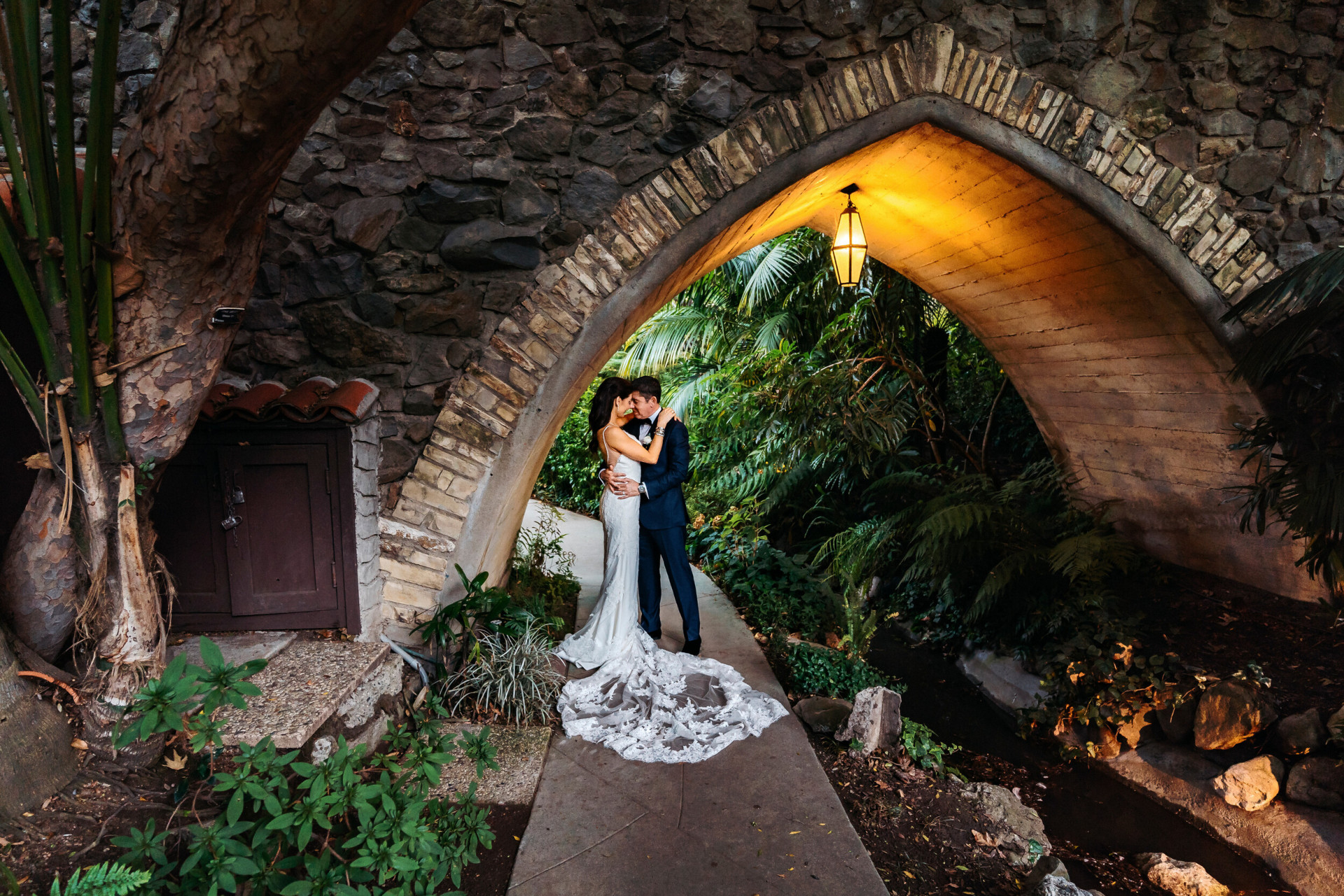 Bride and Groom posing under bridge at Hotel Bel-Air, Los Angeles