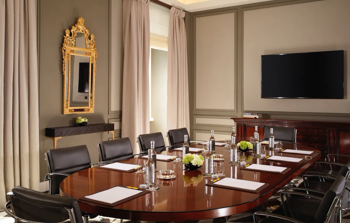 Sala Ludovisi boardroom with screen on wall at Hotel Eden, Rome