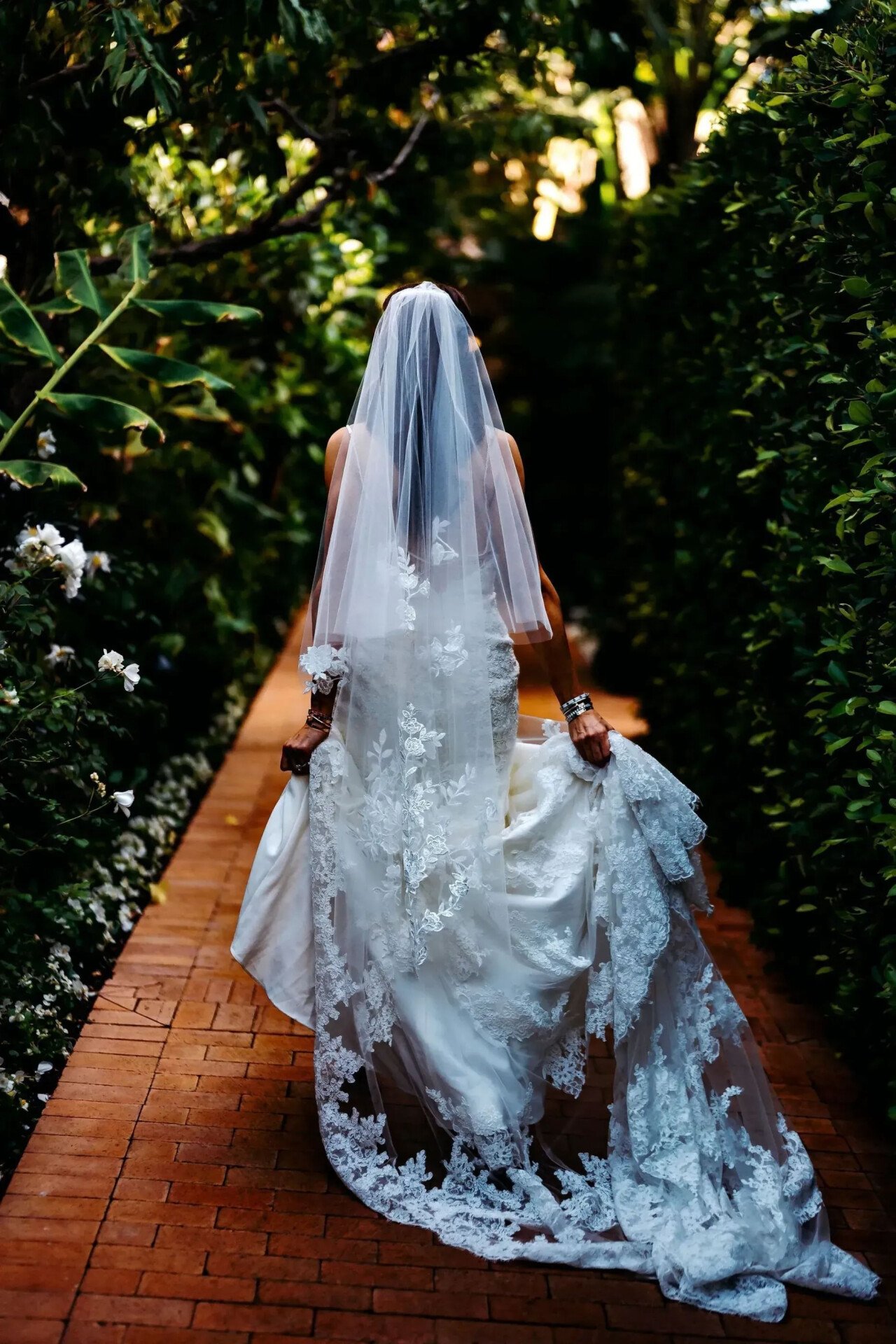 Hotel Bel-Air Bride walks down garden pathway