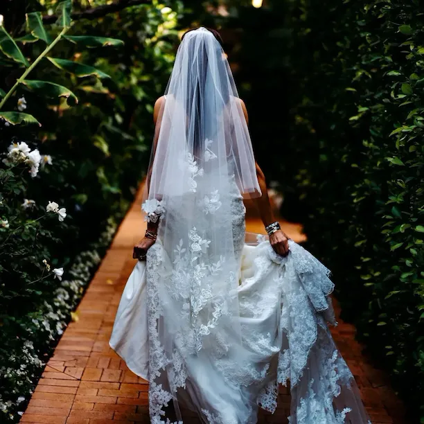 Hotel Bel-Air Bride walks down garden pathway