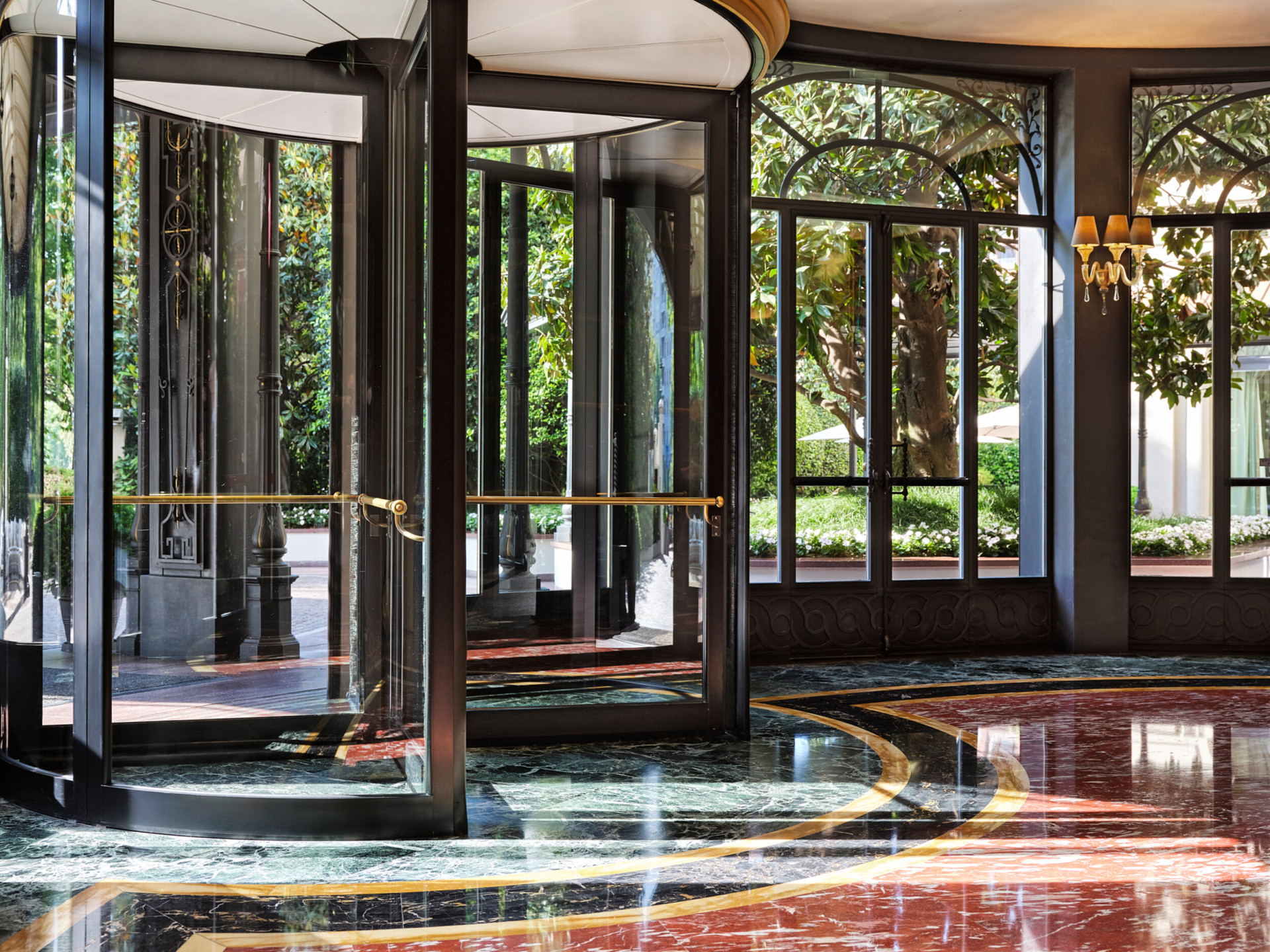 View of the hotel entrance and the black and gold revolving door