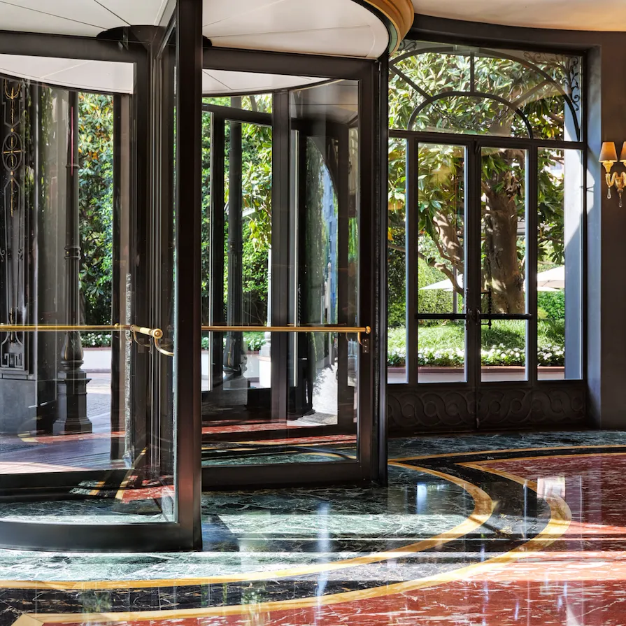 View of the hotel entrance and the black and gold revolving door