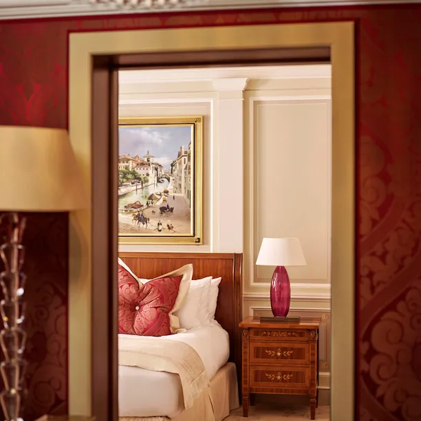 Principe Suite Bedroom Snippet showing part of the king size bed and the large painting above the headboard