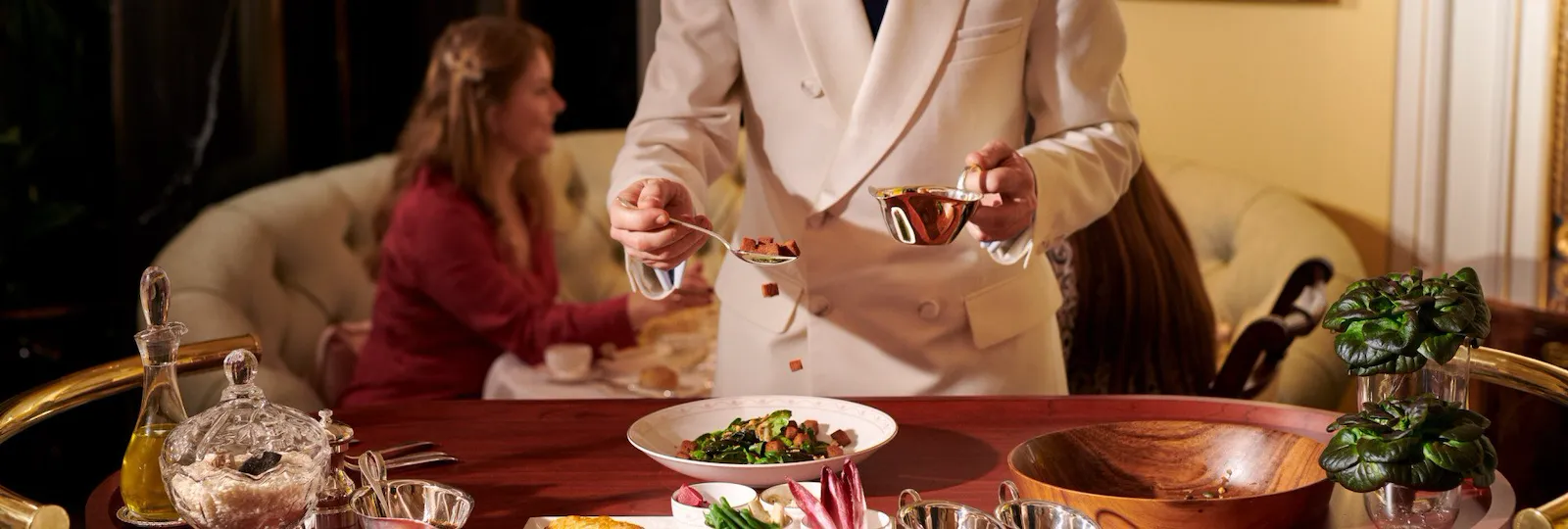 Salad trolley in The Promenade at The Dorchester. Woman making salad