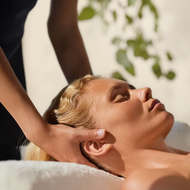 Facial massage treatment performed on female model