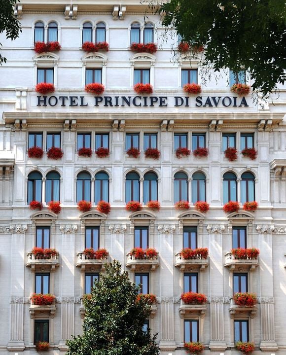 Hotel Principe di Savoia facade with red flowers on the balconies front view