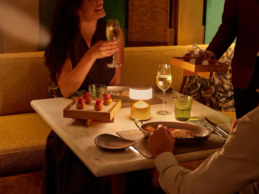 A couple enjoying drinks at Jara by Martin Berasategui