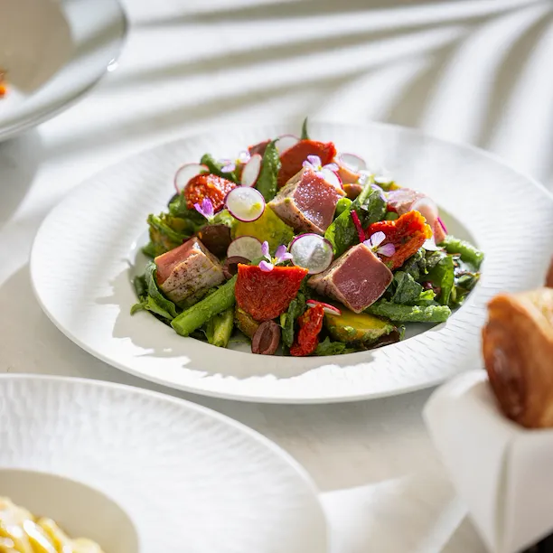 Tuna Nicoise Salad plated on table