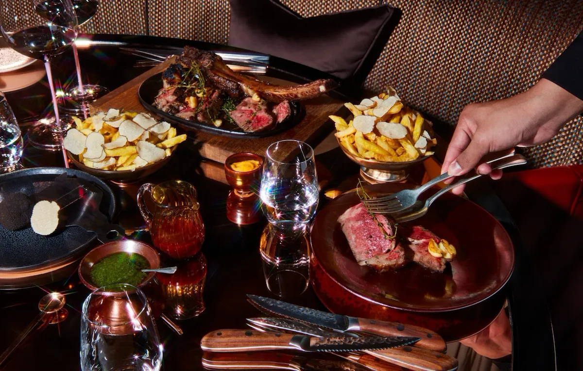 Dinner Menu at CUT served in a fabulous setting with flowers on the table