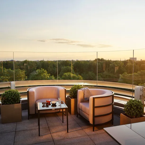 The Penthouse terrace with views of Hyde Park at sunset, at 45 Park Lane, London