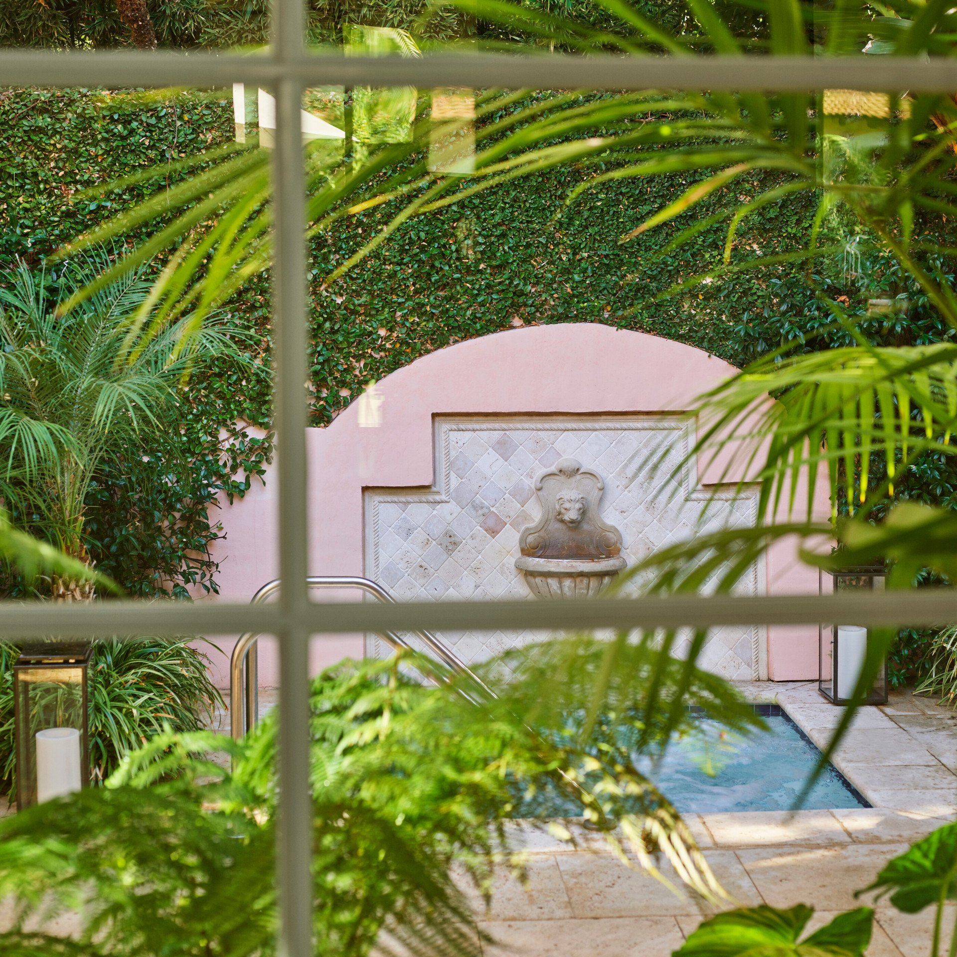 View through window of Presidential Suite patio with jacuzzi