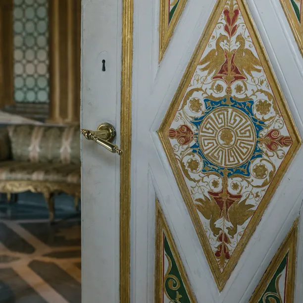 Door with gold trim inside Villa Torlonia in Rome