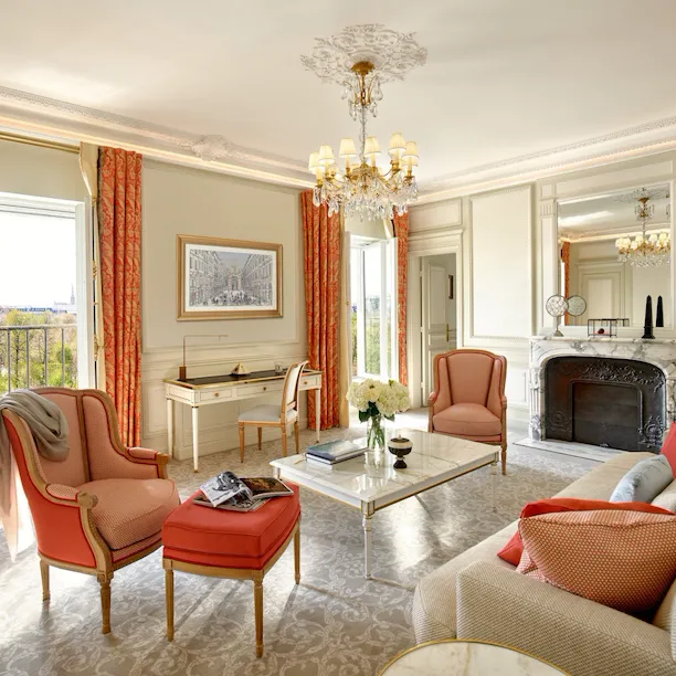 Executive suite living room with open doors to Tuileries garden view at Le Meurice, Paris