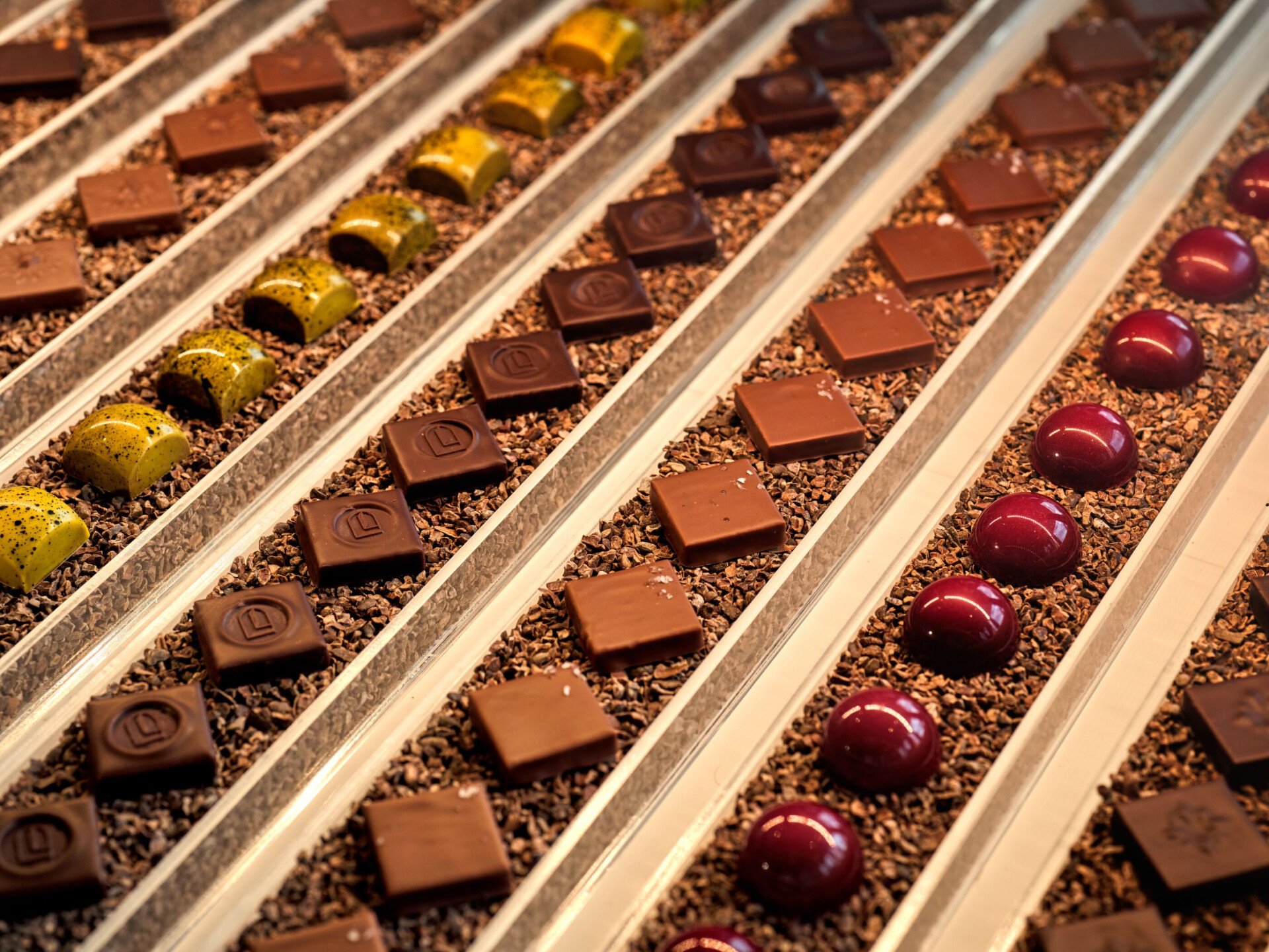 Pictures depict Bonbon Café Angelo Musa offerings, including chocolates and pastries.