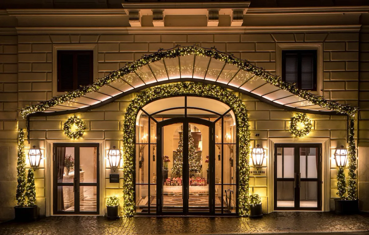 Night shot of Hotel Eden's exterior with Christmas decorations