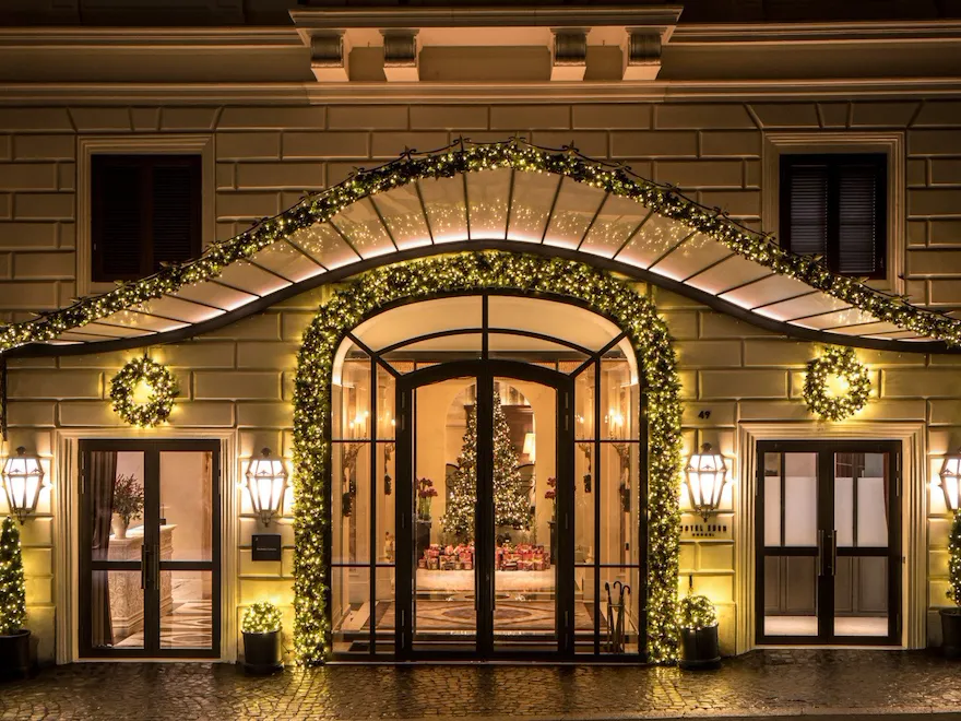 Night shot of Hotel Eden's exterior with Christmas decorations
