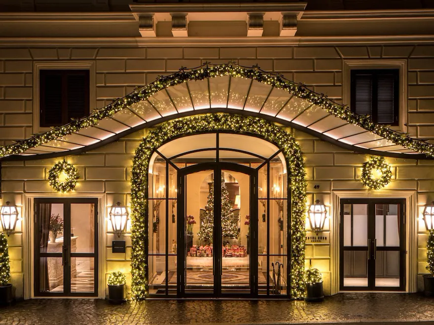 Night shot of Hotel Eden's exterior with Christmas decorations