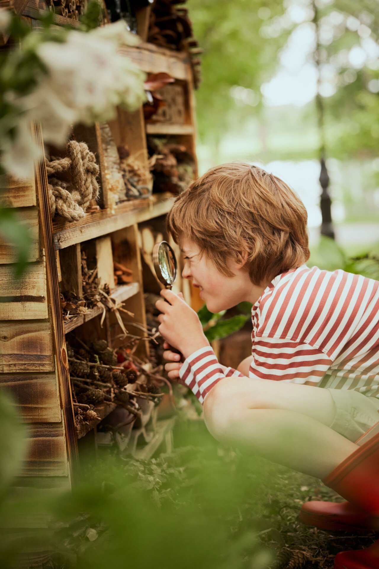 Children playing with flowers and wild flowers in the Coworth Park Grounds