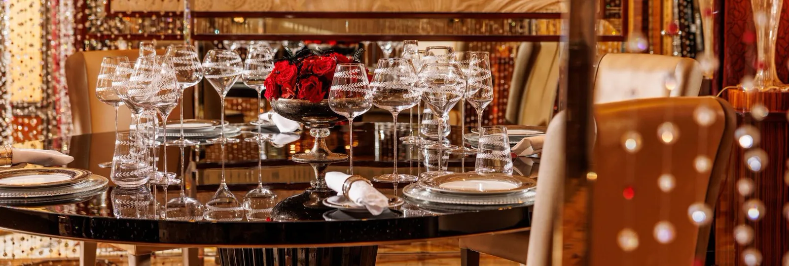 view of Tavolo Cristallo with its Swarovsky curtains and red roses as centrepiece