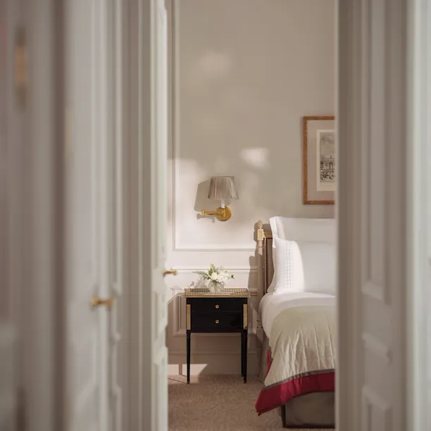 This is the bedroom of the Superior Suite #218 at the Plaza Athénée seen from the living room doors.