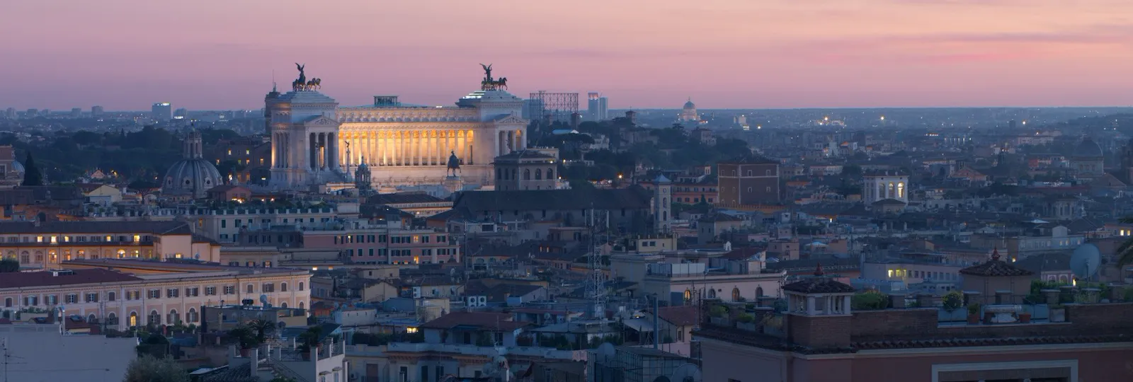 view of Rome and Vittoriano monument at dusk from Hotel Eden