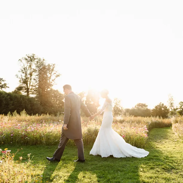 Coworth Park-Weddings-Meadow couple sunset-Credit Fiona Kelly