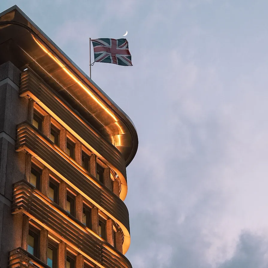 Exterior of hotel lit up at dusk