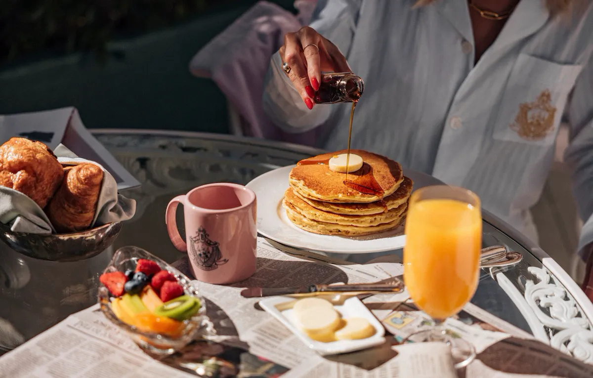 model enjoying room service on the patio
