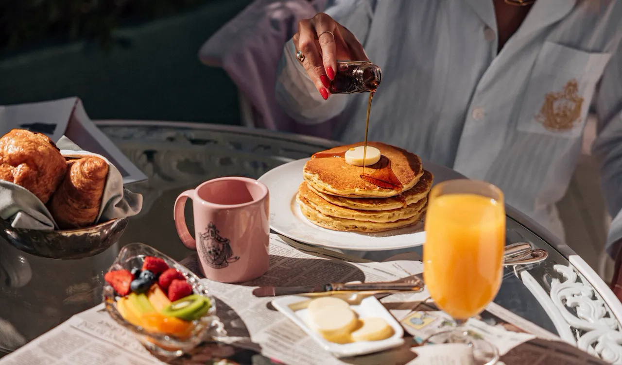 model enjoying room service on the patio