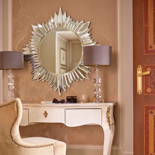 Principe Suite Detail showing a mirrored vanity table and a pair of lilac shoes on the floor