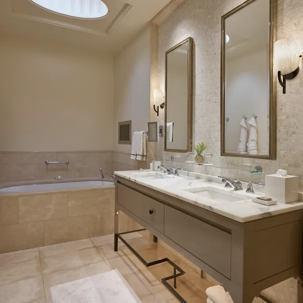 Vanity in marble bathroom of suite at Hotel Bel-Air