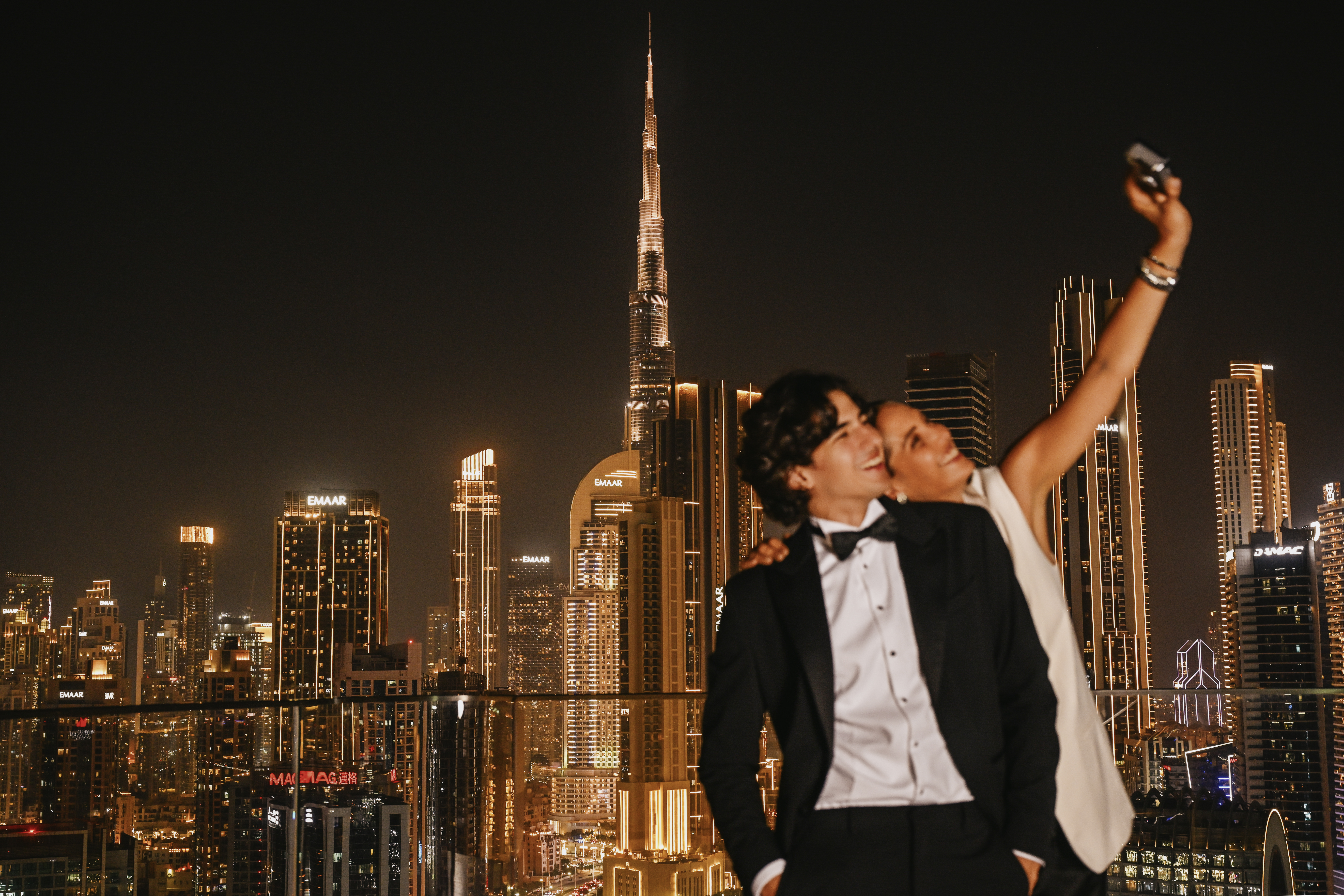 A couple taking photos in High Society