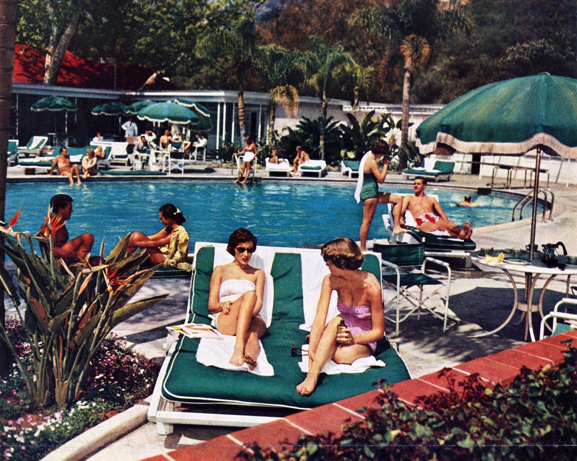Historical photo of guests by the pool at Bel-Air