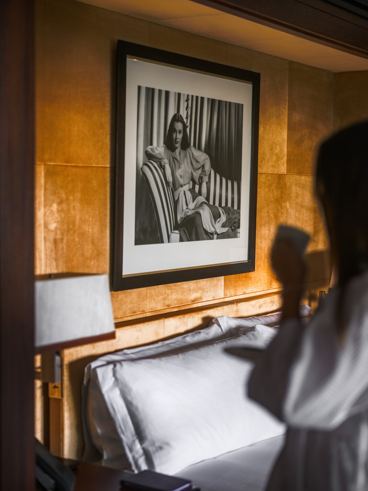 Lady drinking tea in bedroom 