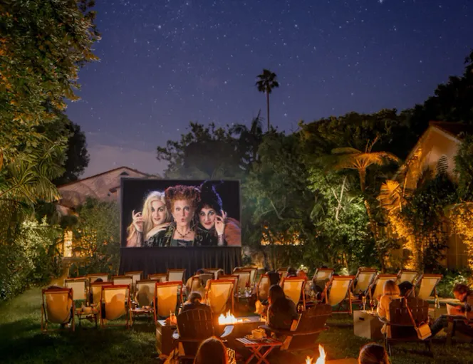 Outdoor movies series on the front lawn, guests watching Halloween movie