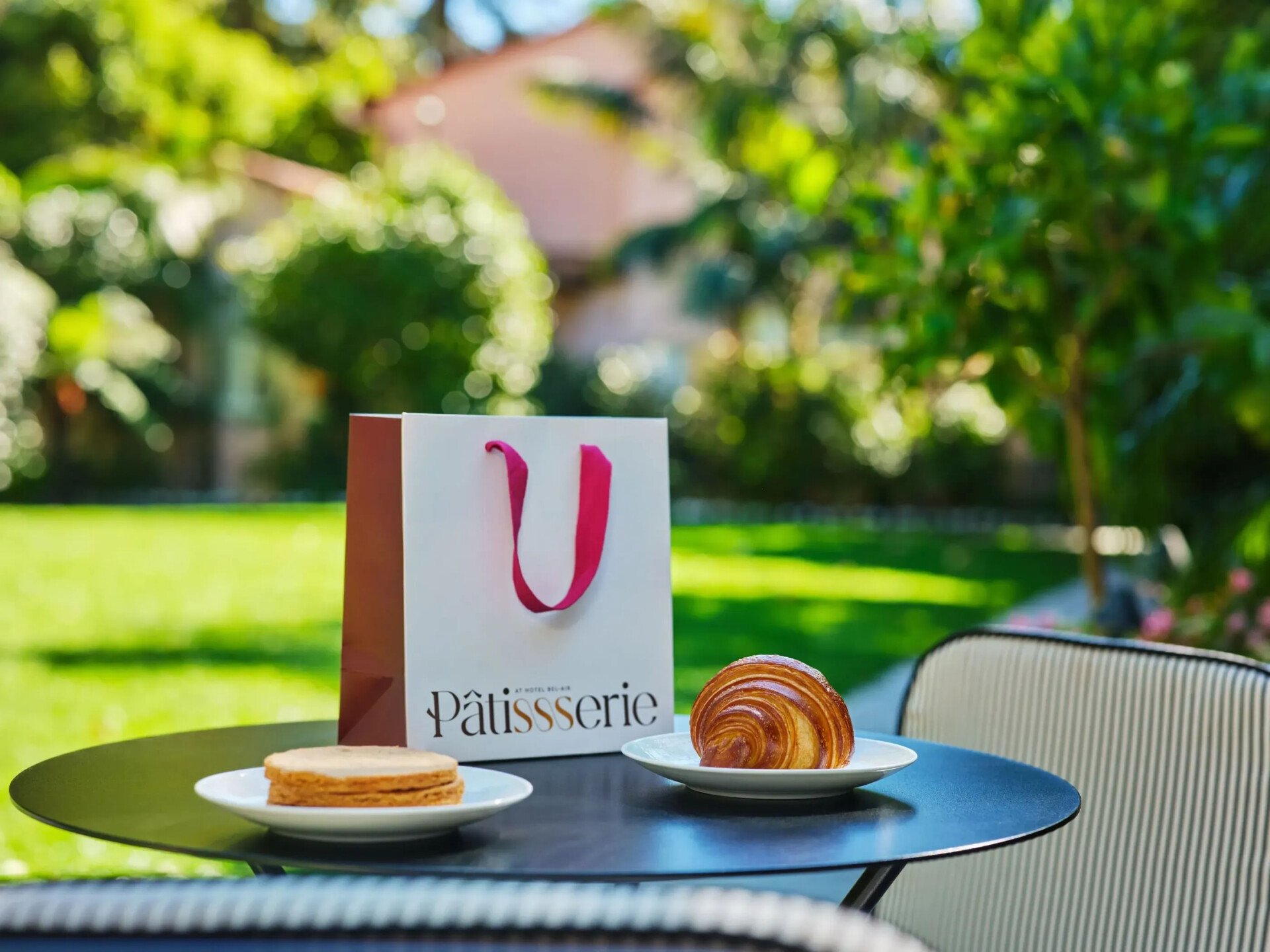 Coffee and croissant close-up moment in The Patisserie courtyard 
