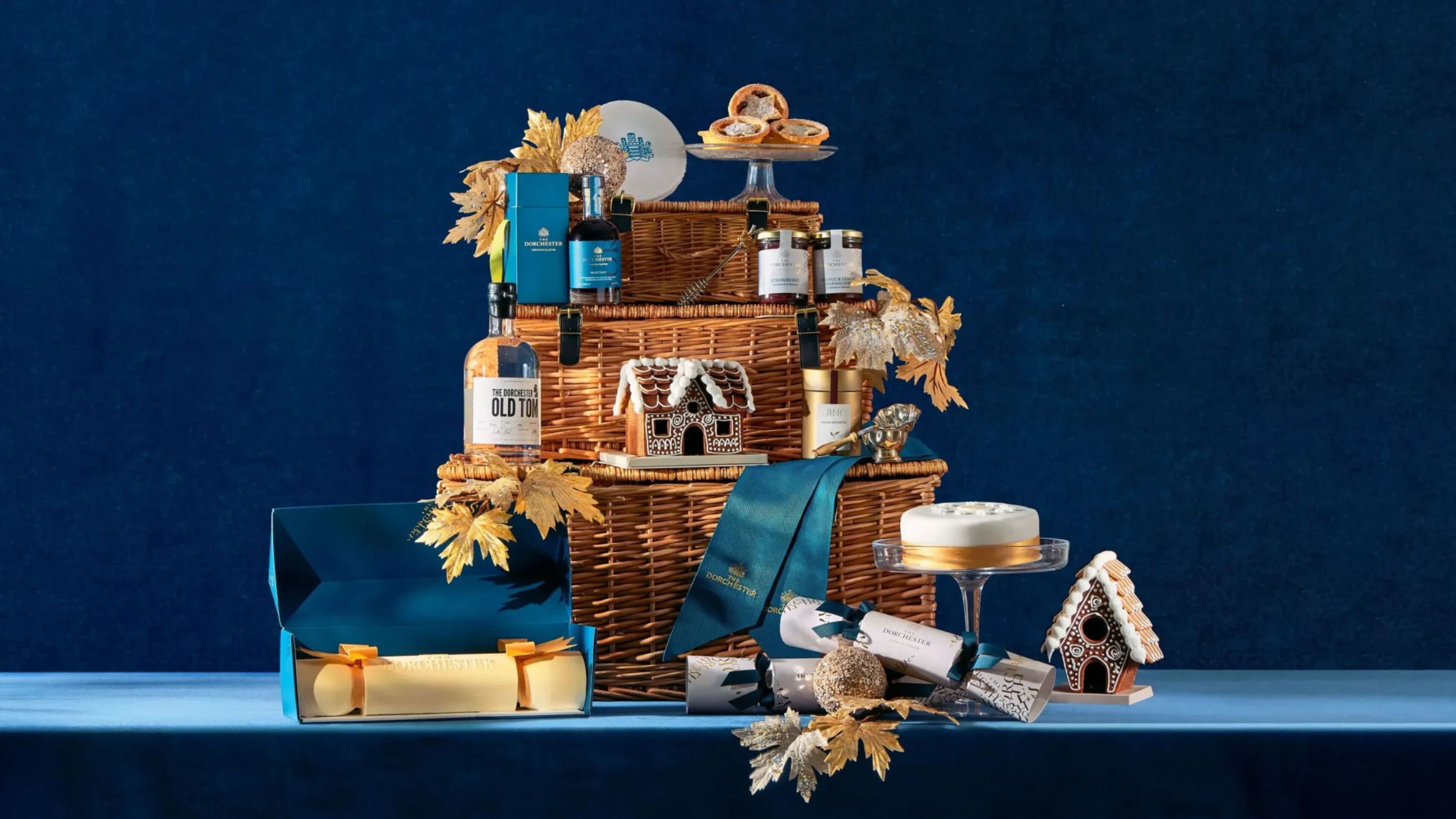 The Dorchester Retail items on blue velvet backdrop with soft dappled lighting