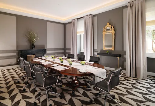Sala Ludovisi boardroom with table set for private dining at Hotel Eden, Rome