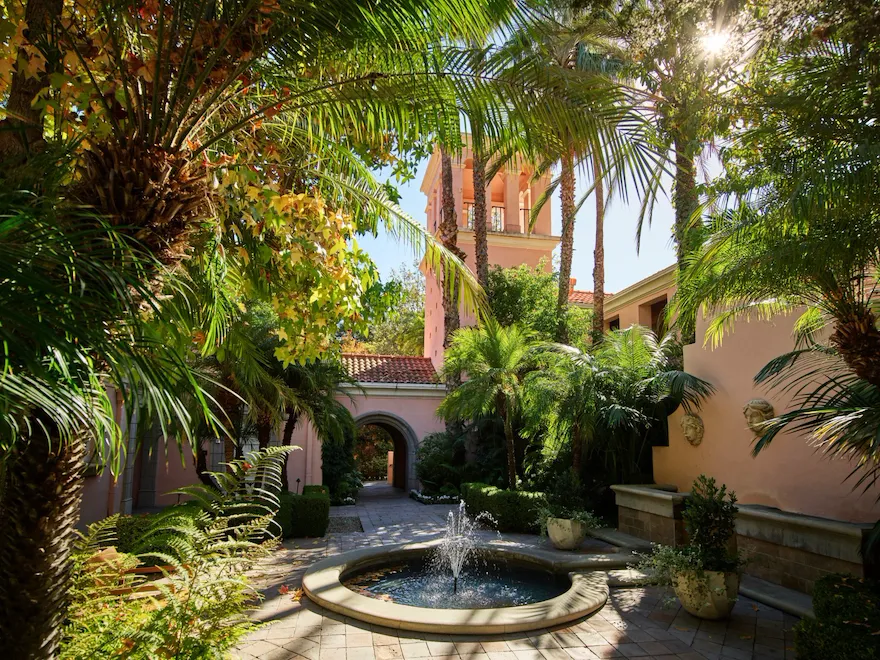 Courtyard with fountain and palm trees at Hotel Bel-Air