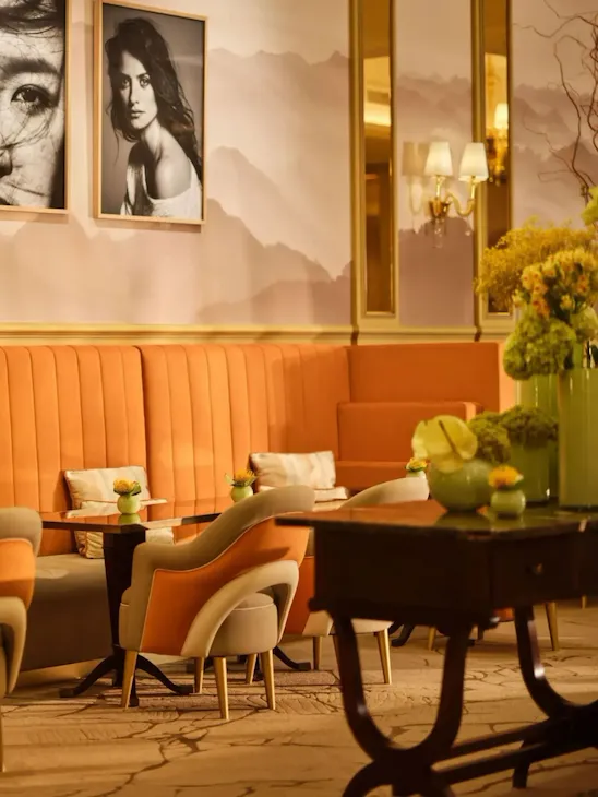 Il Salotto lobby lounge with black and white photographs hanging on the walls